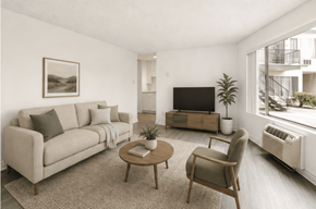 El Cajon apartment for rent - A living room with a couch, chair, and television.