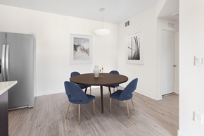 Henderson apartment for rent - A modern dining room with a round table and chairs.