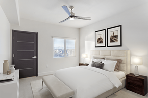 Henderson apartment for rent - A bedroom with a large bed and a ceiling fan.