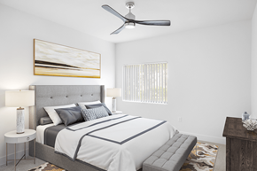 Las Vegas apartment for rent - A bedroom with a large bed and a ceiling fan.