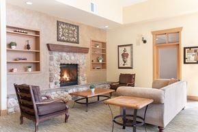 Puyallup apartment for rent - A living room with a fireplace and a couch.
