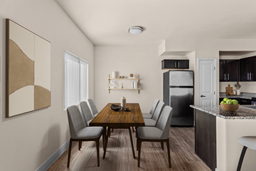 Henderson apartment for rent - A modern kitchen with a dining table and chairs.