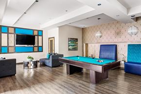 Nashville apartment for rent - A room with a pool table and a television.