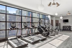 Nashville apartment for rent - A gym with treadmills, elliptical machines, and other exercise equipment.