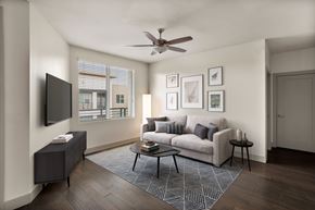 Tempe apartment for rent - A living room with a couch, a television, and a coffee table.