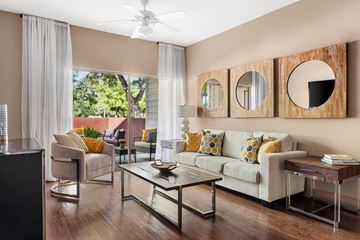 Austin apartment for rent - A living room with a white couch and a glass coffee table.