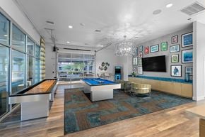 Phoenix apartment for rent - A room with a pool table and a bar.