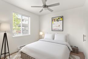 Everett apartment for rent - A bedroom with a large bed and a picture of Copenhagen on the wall.