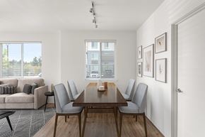 Everett apartment for rent - A dining room with a wooden table and grey chairs.