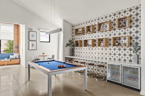 Everett apartment for rent - A pool table in a room with a wallpapered wall.