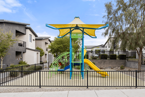 Las Vegas apartment for rent - A playground with a blue and yellow slide and a yellow canopy.
