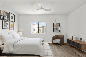 Las Vegas apartment for rent - A bedroom with a large bed and a chair.