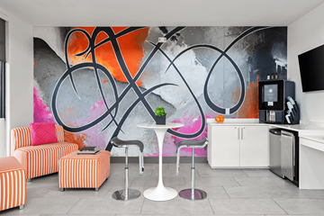 Las Vegas apartment for rent - A modern living room with a large abstract painting on the wall.