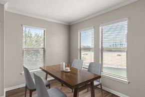 Irving apartment for rent - A dining room with a wooden table and chairs.