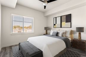 Stockton apartment for rent - A bedroom with a large bed and a ceiling fan.
