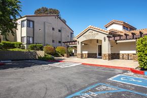 Santa Clarita apartment for rent - A parking lot with a building named Canyon Sides in the background.
