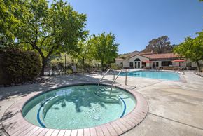Santa Clarita apartment for rent - A round pool with a hot tub in the middle.
