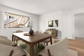 El Cajon apartment for rent - A dining room with a wooden table and chairs.
