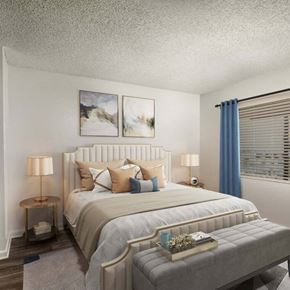 Grand Terrace apartment for rent - A bedroom with a large bed and two lamps.