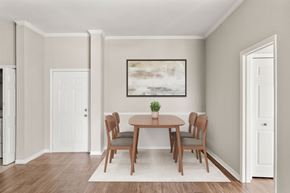 Jacksonville apartment for rent - A dining room with a table and chairs.