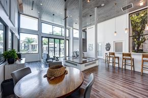 Lakewood apartment for rent - A modern dining room with a wooden table and chairs.