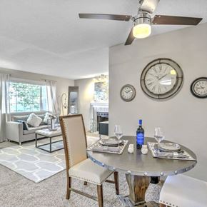 Renton apartment for rent - A dining room with a table set for two and a ceiling fan.