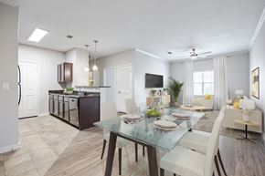 San Antonio apartment for rent - A modern dining room with a glass table and chairs.