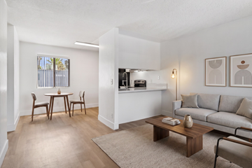 El Cajon apartment for rent - A living room with a dining table and chairs.