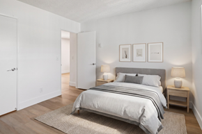 El Cajon apartment for rent - A bedroom with a large bed and two nightstands.