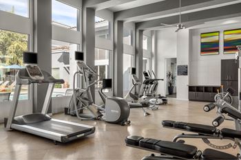 24-Hour fitness center w/ free weights & personal tv monitors