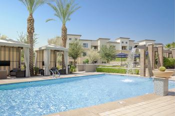 Resort-style swimming pool w/ spa & water feature