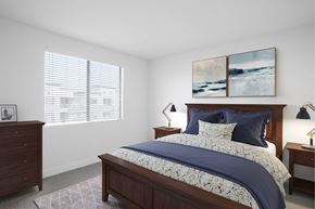 Gilbert apartment for rent - A bedroom with a large bed and two lamps.