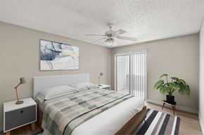 Mesa apartment for rent - A bedroom with a bed, a ceiling fan, and a painting on the wall.