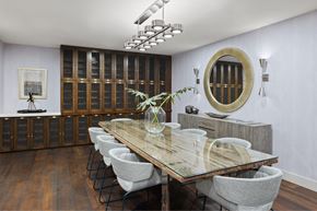 Los Angeles apartment for rent - A dining room with a wooden table and grey chairs.