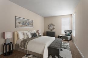 Los Angeles apartment for rent - A bedroom with a large bed and a painting on the wall.