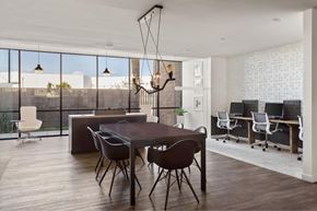 Los Angeles apartment for rent - A modern dining room with a large table and chairs.