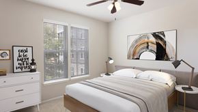 Tampa apartment for rent - A bedroom with a bed, nightstand, and a painting on the wall.