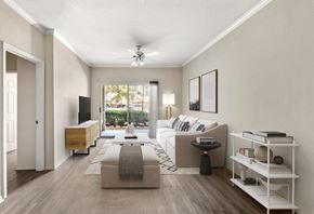 Jacksonville apartment for rent - A living room with a couch, a coffee table, and a television.