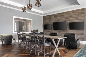 Sarasota apartment for rent - A modern dining room with a wooden table and chairs.