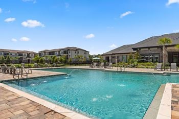 Beach-entry saltwater swimming pool w/ sun deck