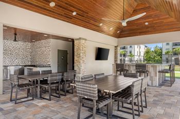 Screened-in outdoor living area w/ fireplace