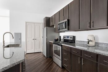 Chef-inspired kitchen w/ sleek stainless-steel appliances