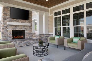 Multiple outdoor cozy conversation spaces w/ fireplaces