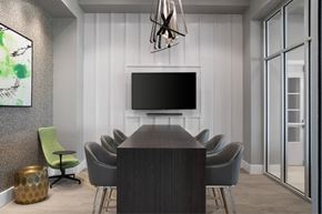 Charlotte apartment for rent - A conference room with a long table and chairs.
