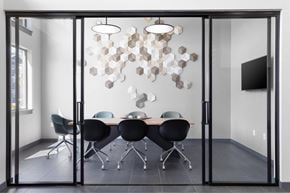 Oregon City apartment for rent - A conference room with a glass table and chairs.