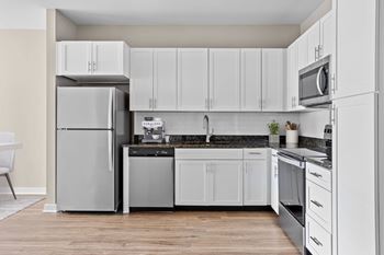 Ultra-modern kitchen w/ granite countertops