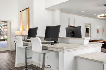 Sophisticated resident lounge w/ computer kiosks