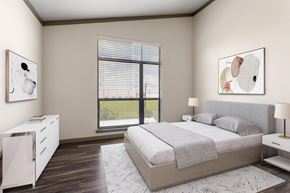 San Antonio apartment for rent - A bedroom with a large bed and a white cabinet.