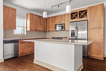 Fully-equipped gourmet kitchens w/ designer finishes, ceramic-tile backsplashes, double stainless-steel sinks, prep islands, stainless-steel appliances & usb outlets