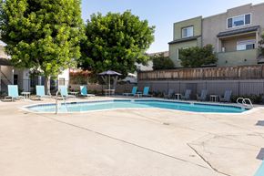 San Ysidro apartment for rent - A swimming pool surrounded by trees and chairs.